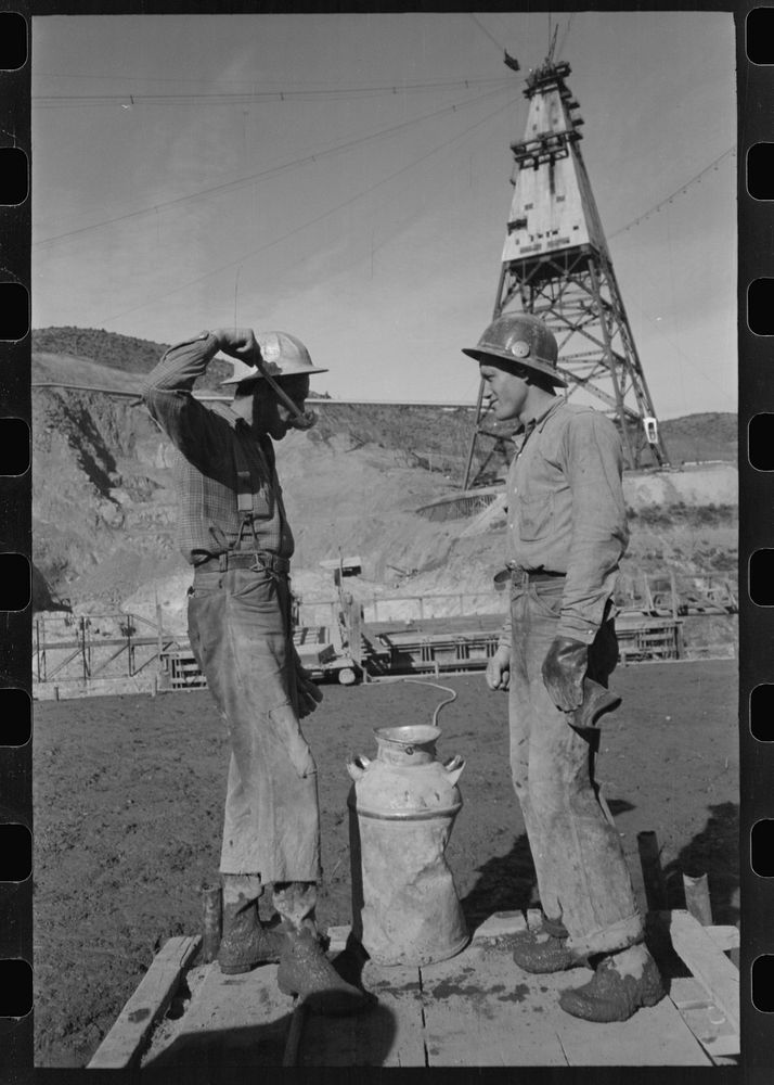 Construction workers getting a drink of water. Main distributing tower is in the rear. Shasta Dam, Shasta County, California…