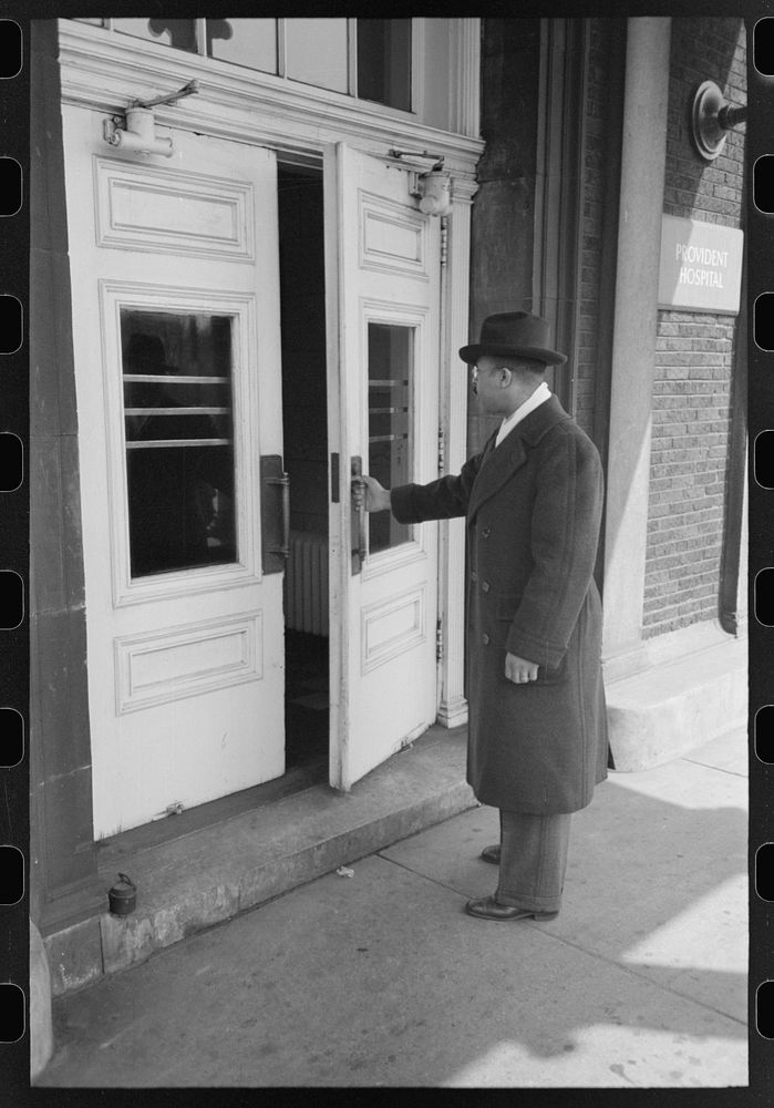 Doctor entering Provident Hospital, South Side of Chicago, Illinois by Russell Lee