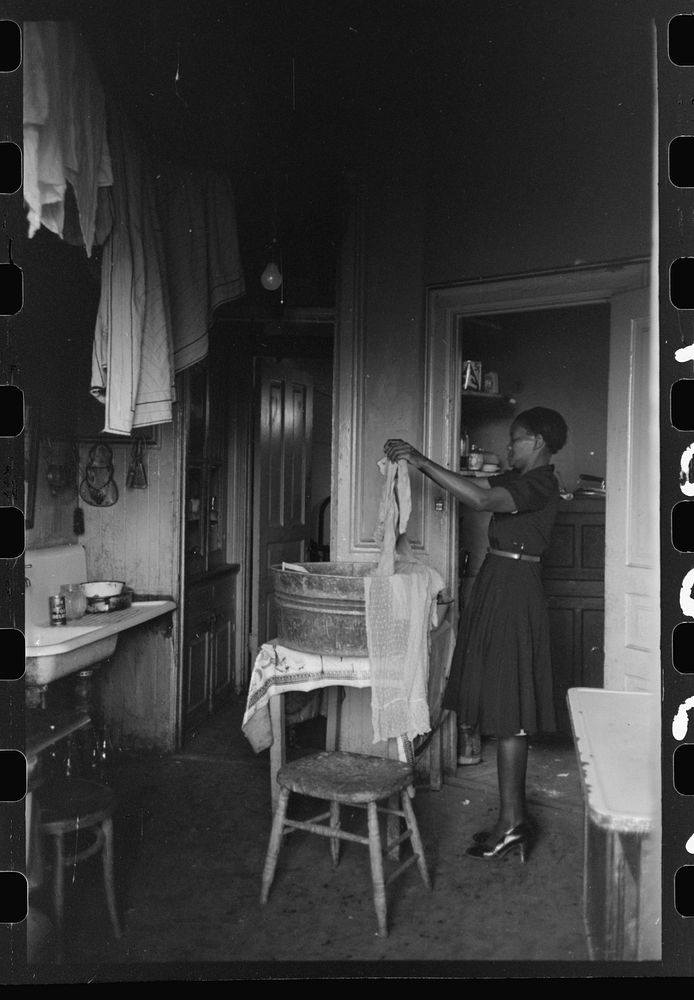 Kitchen of apartment occupied by African American, South Side of Chicago, Illinois by Russell Lee