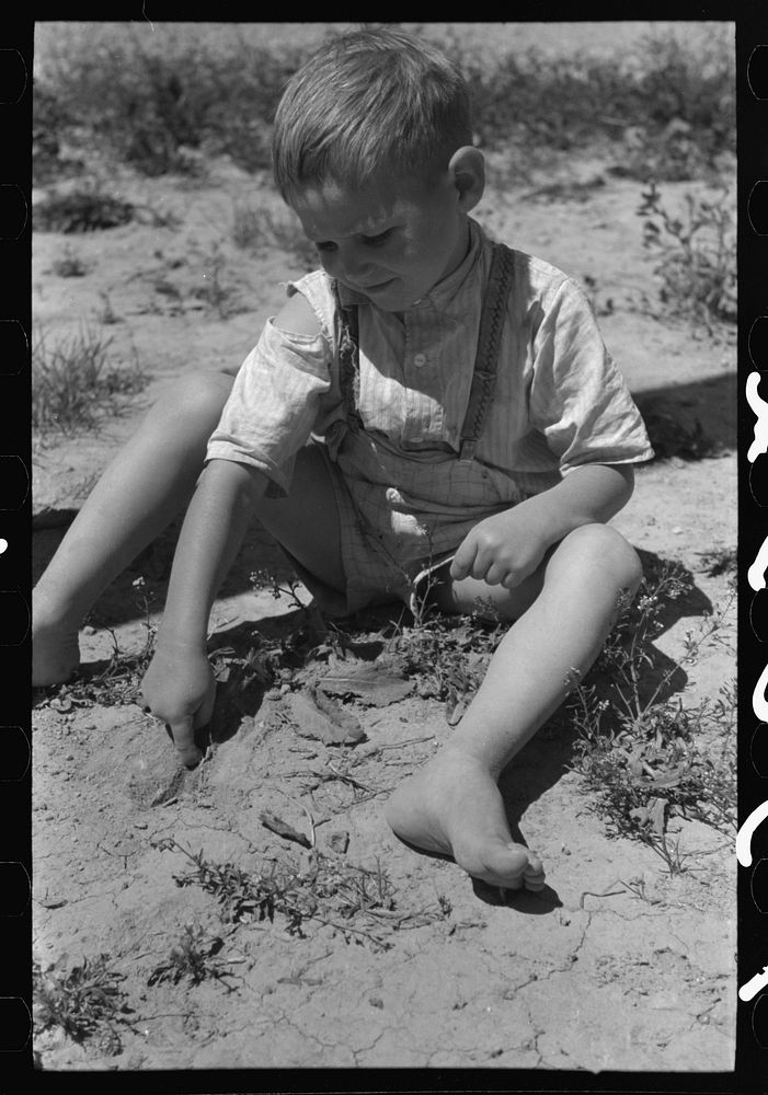 [Untitled photo, possibly related to: Son of the farm worker at the FSA (Farm Security Administration) labor camp. Caldwell…