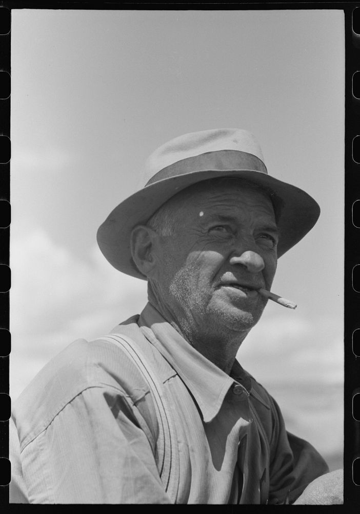 Checker, labor contractor's pea pickers crew, Nampa, Idaho by Russell Lee