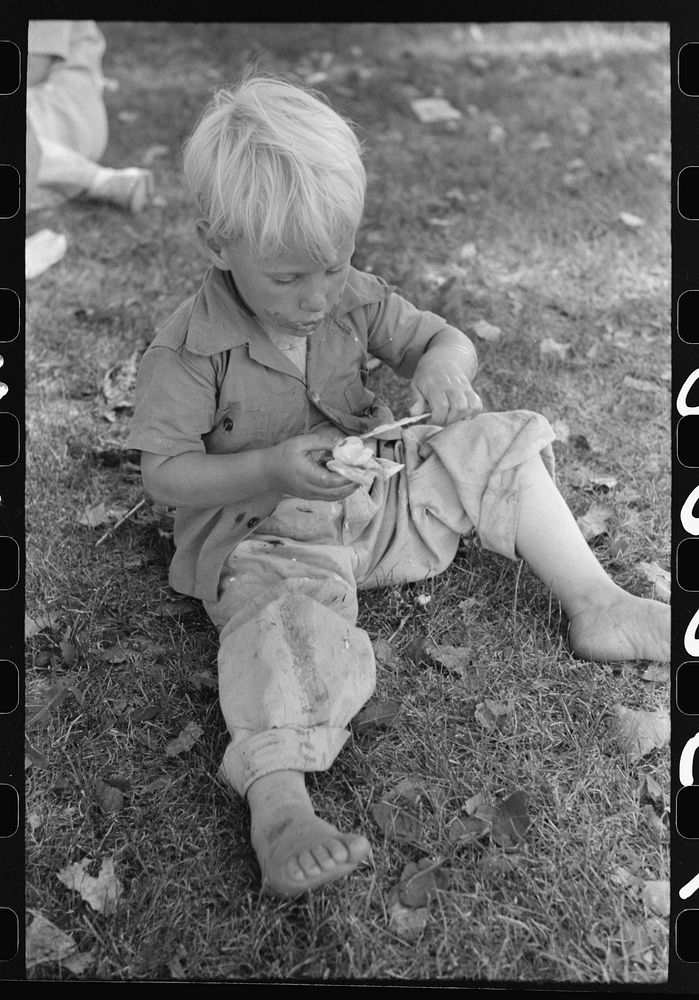 Little boy enjoys his ice cream, Fourth of July, Vale, Oregon by Russell Lee
