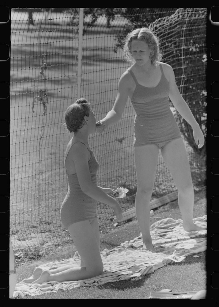 Sun bathers at the park swimming pool, Caldwell, Idaho by Russell Lee