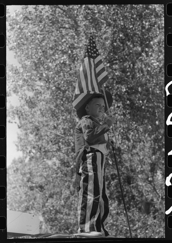 Boy on float in Fourth of July parade. Vale, Oregon by Russell Lee