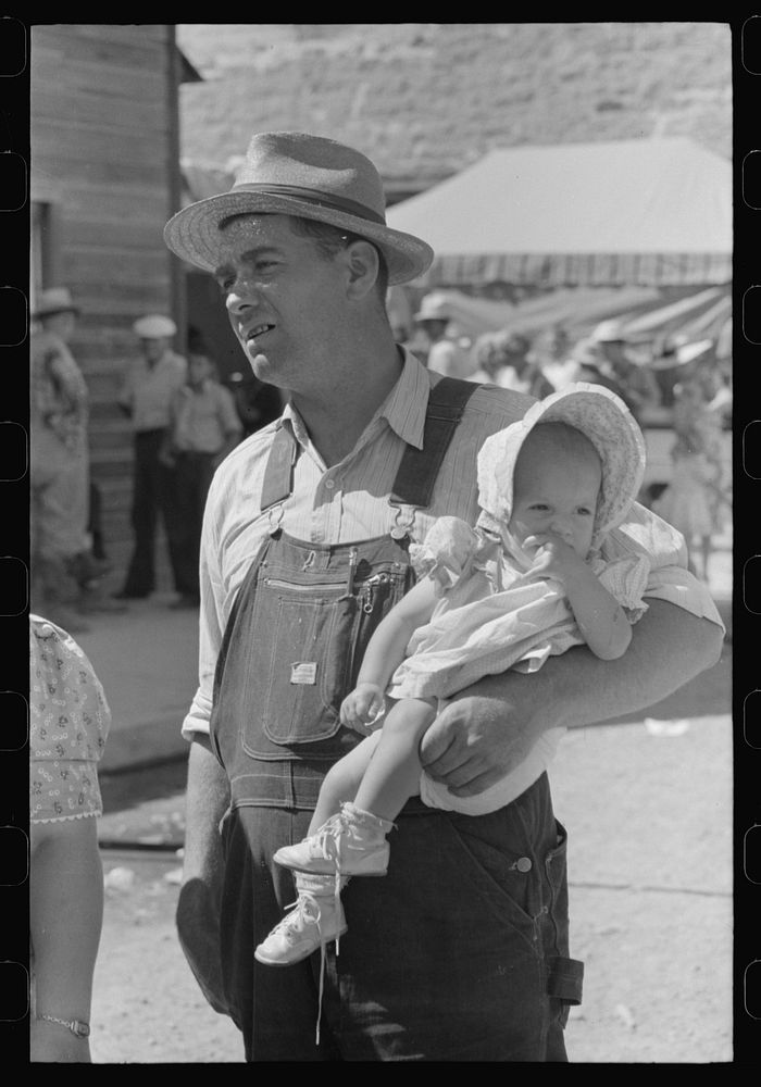 Farmer and young daughter in town for the Fourth of July, Vale, Oregon by Russell Lee