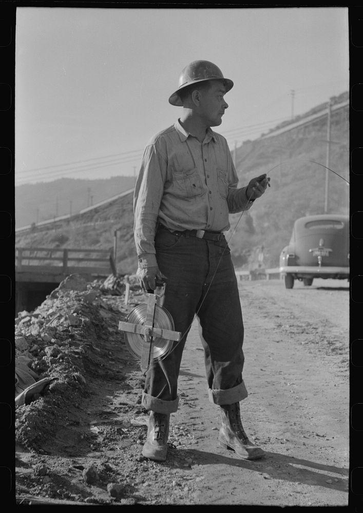 Chain man of surveying crew at Shasta Dam, Shasta County, California by Russell Lee