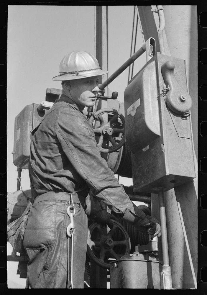Operator of buckets which deliver materials to construction points of Shasta Dam, Shasta County, California by Russell Lee