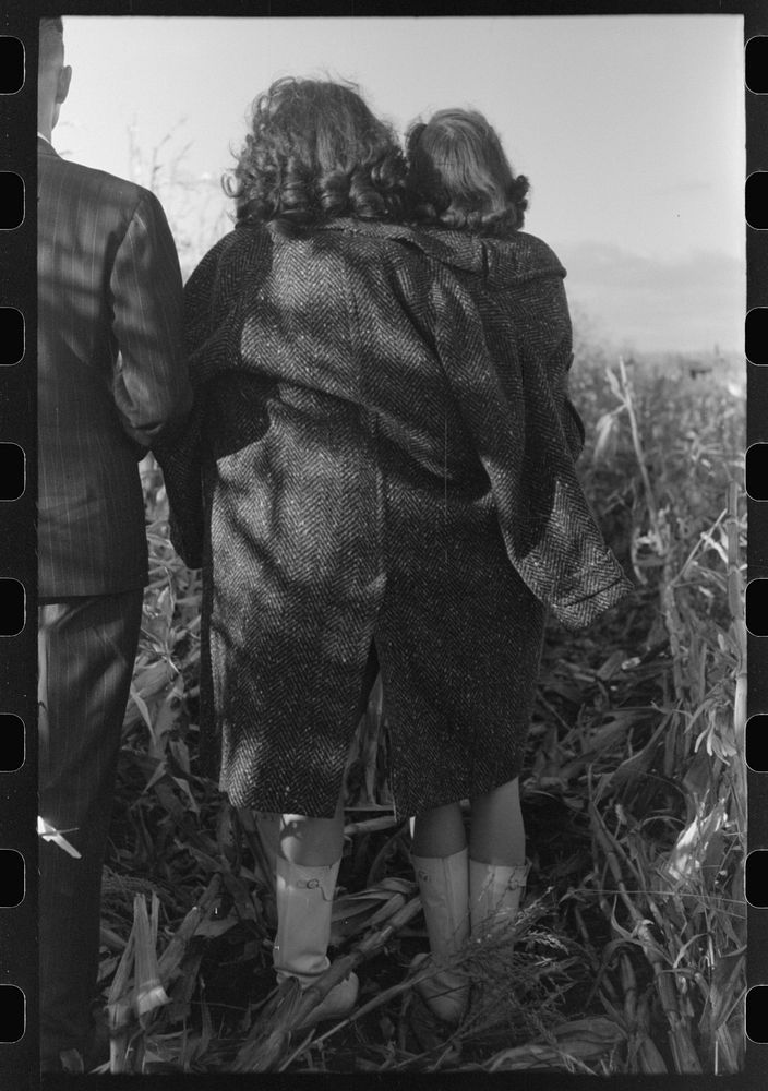 [Untitled photo, possibly related to: Girls who play in the band watch cornhusking contest, Ontario, Oregon] by Russell Lee
