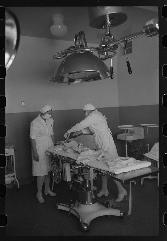 Getting ready for operation at the Cairns General Hospital at the FSA (Farm Security Administration) farmworkers community…