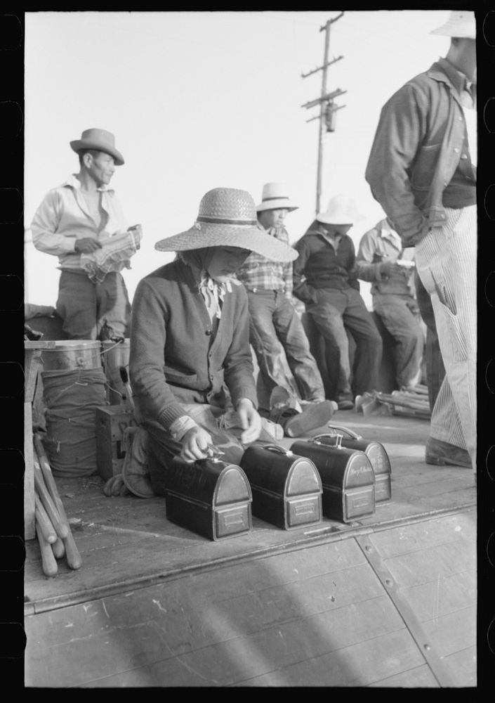 Nyssa, Oregon. FSA (Farm Security Administration) mobile camp. Japanese-American farm workers leaving the camp by Russell Lee
