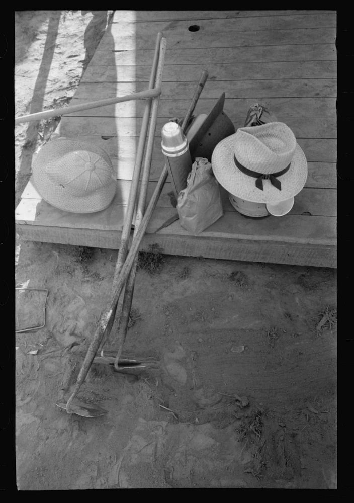 Nyssa, Oregon. FSA (Farm Security Administration) mobile camp. Hoes, lunch bags, and other belongings of Japanese-Americans…