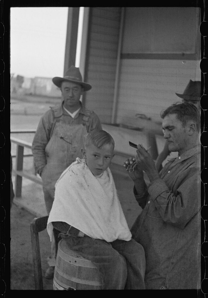 [Untitled photo, possibly related to: Community barber shop in Kern County migrant camp, California]. Sourced from the…