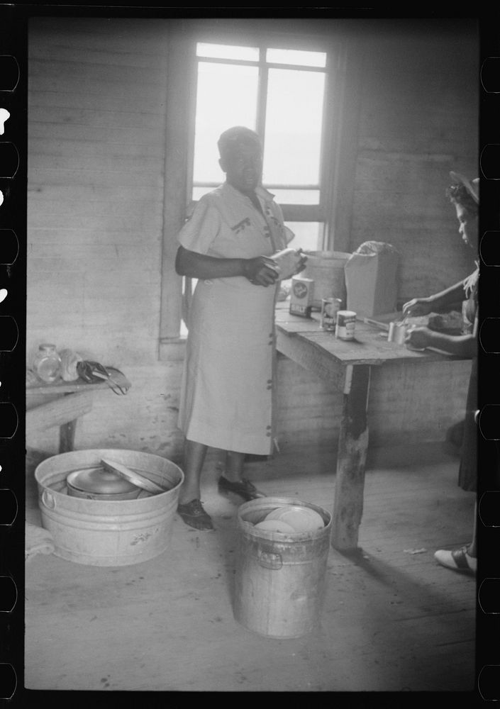The cook of a crew of migrants packing her cooking utensils for a trip from Belcross, North Carolina to Onley, Virginia.…