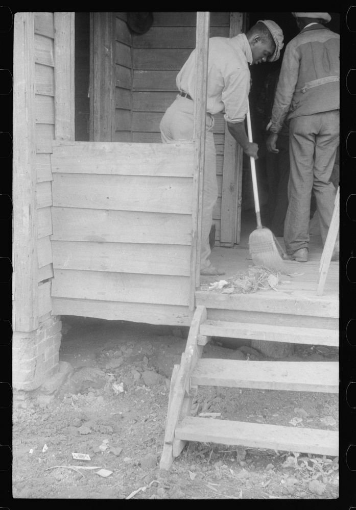 Migrant cleaning up the house before leaving Belcross, North Carolina for another job at Onley, Virginia. Sourced from the…