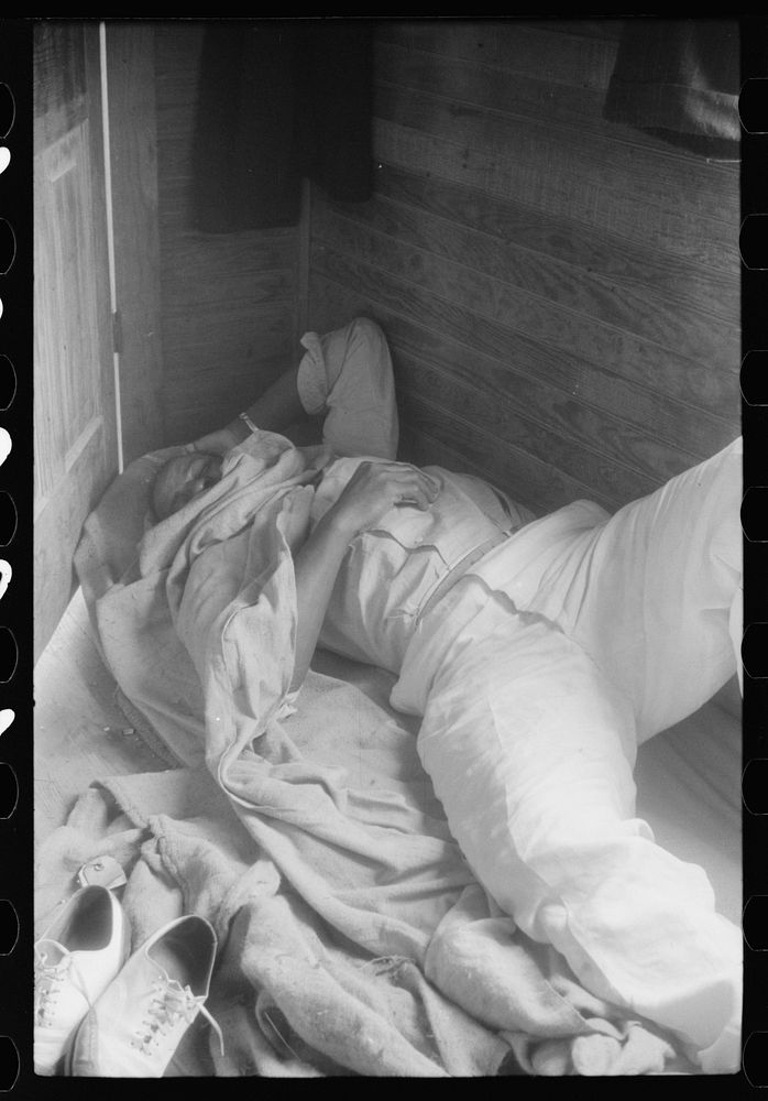 Sleeping quarters for migratory worker in a house on a potato field, near Belcross, North Carolina. Sourced from the Library…