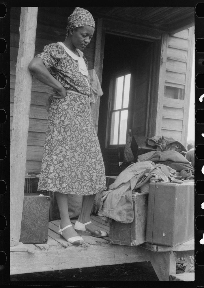 Georgia migratory agricultural worker waiting for the truck which will take her to another job at Onley, Virginia. Sourced…