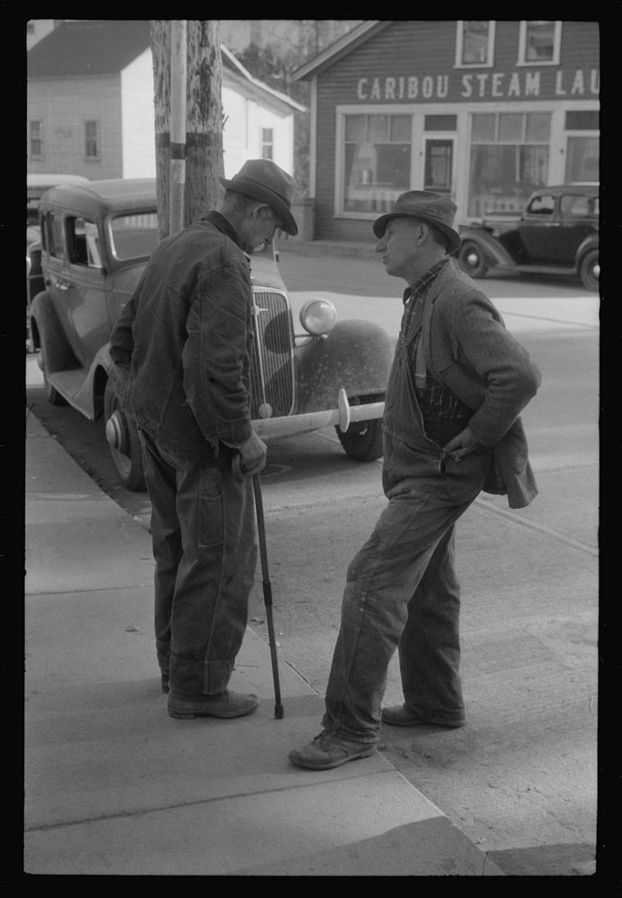 Two potato farmers in town Saturday afternoon in Caribou, Maine. Sourced from the Library of Congress.