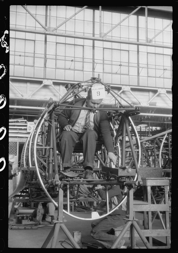 Working on the fuselage assembly at the Vought-Sikorsky Aircraft Corporation, Stratford, Connecticut. Sourced from the…
