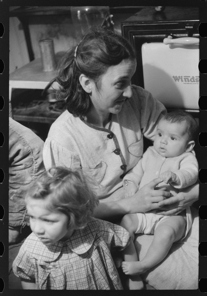 [Untitled photo, possibly related to: Wife and children of Dennis Decosta, Portugese FSA (Farm Security Administration)…