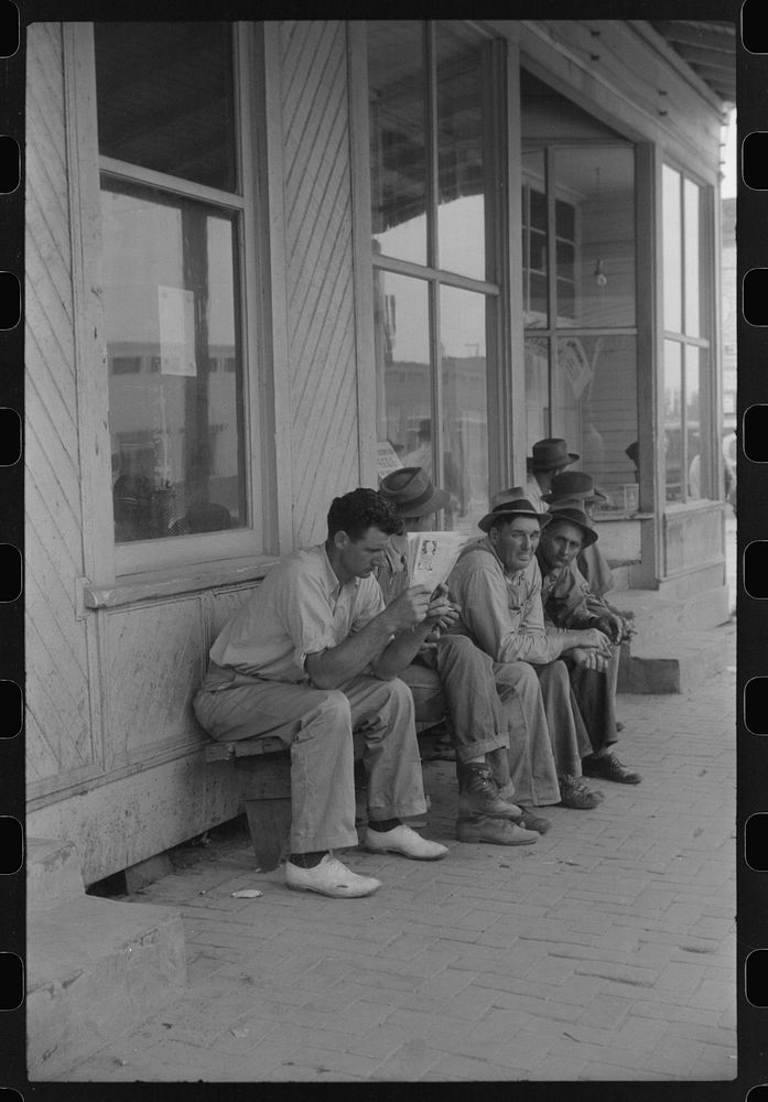 [Untitled photo, possibly related to: Workers, some of them unemployed, on the main street of Childersburg, Alabama].…