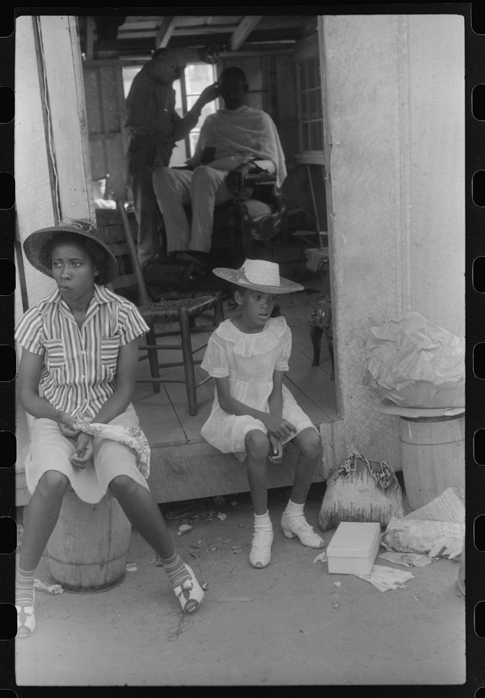 [Untitled photo, possibly related to: Saturday afternoon outside of a  store and barbershop in Union Point, Greene County…