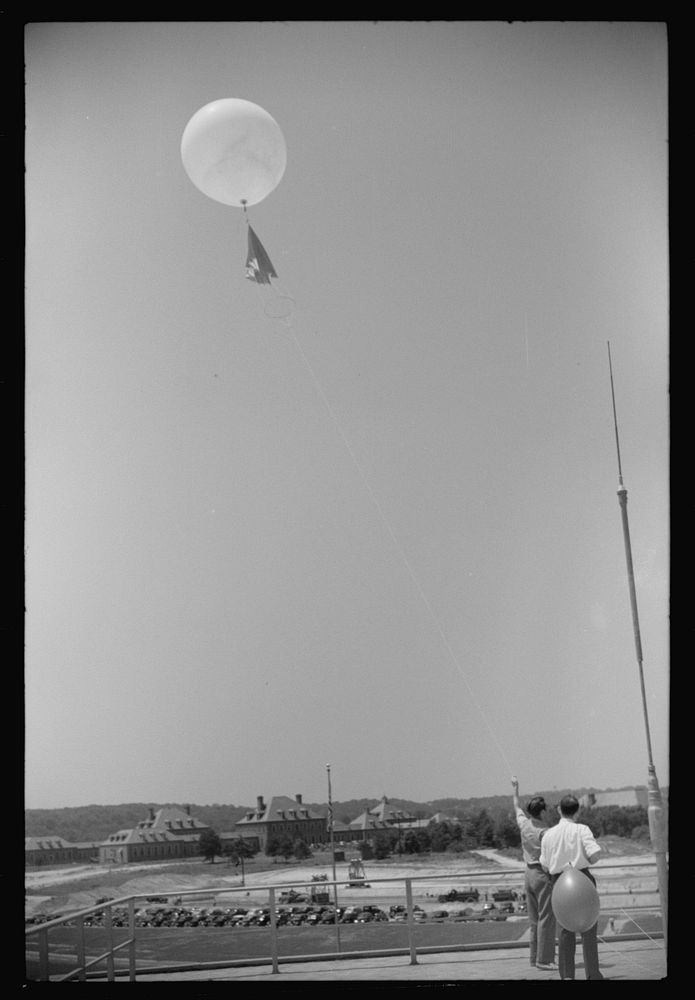 Preparing to send up the weather balloon at the weather bureau at the municipal airport in Washington, D.C.. Sourced from…