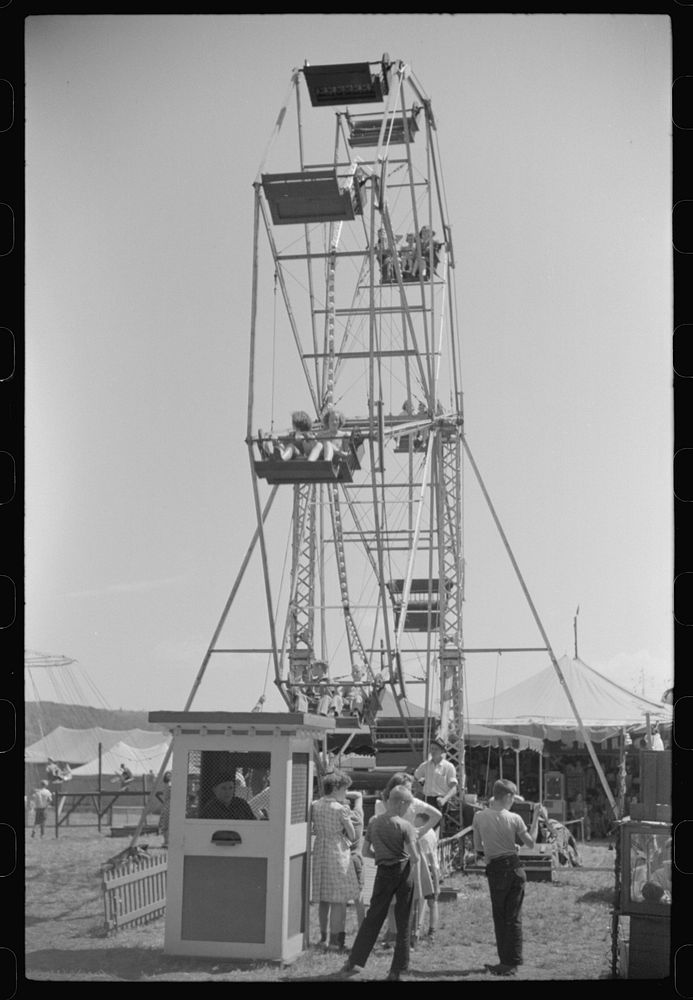 [Untitled photo, possibly related to: Merry-go-round [i.e. ferris wheel] at a small American Legion carnival near Bellows…