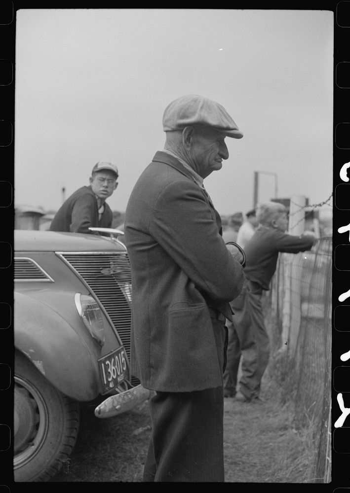 [Untitled photo, possibly related to: Spectator at the auto races at the Champlain Valley Exposition at Essex Junction…