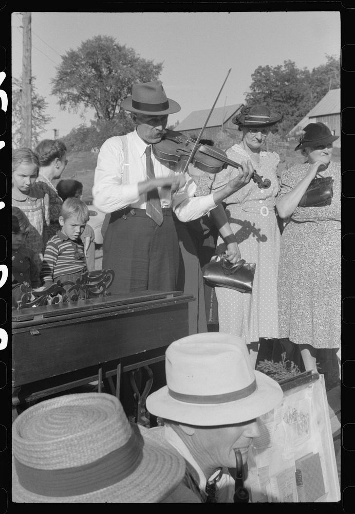Mr. Ed Larkin, seventy-eight year old fiddler at the "World's Fair" in Tunbridge, Vermont. Sourced from the Library of…