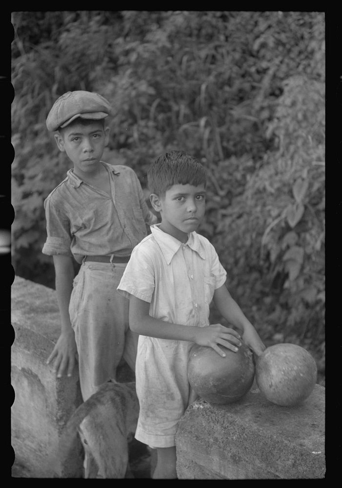 Waiting at a spring to get water which is carried in gourdlike containers. Near Corozal, Puerto Rico. Sourced from the…