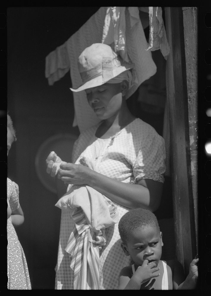 [Untitled photo, possibly related to: Charlotte Amalie, St. Thomas Island, Virgin Islands. Family living in a slum area].…