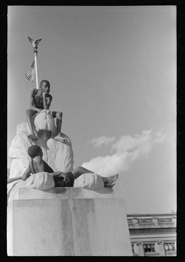 [Untitled photo, possibly related to: Colored boys playing on Columbus Monument. Washington, D.C.] by Marion Post Wolcott