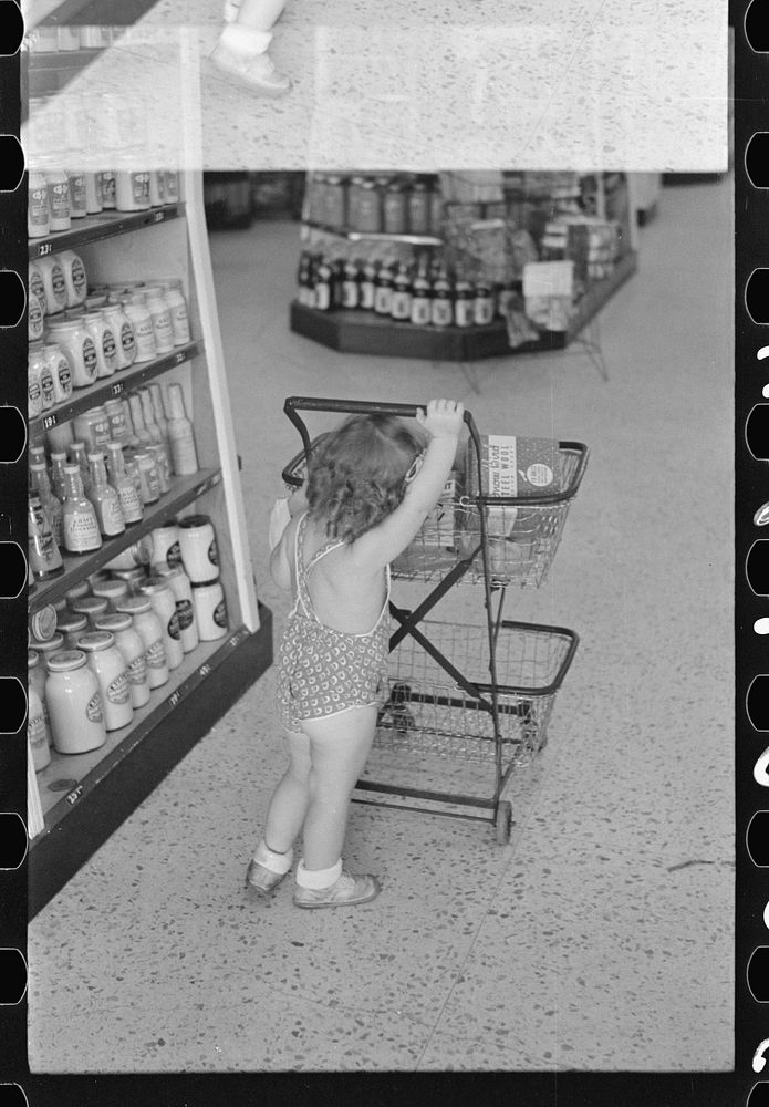 [Untitled photo, possibly related to: Shopping in coop store, Greenbelt, Maryland]. Sourced from the Library of Congress.