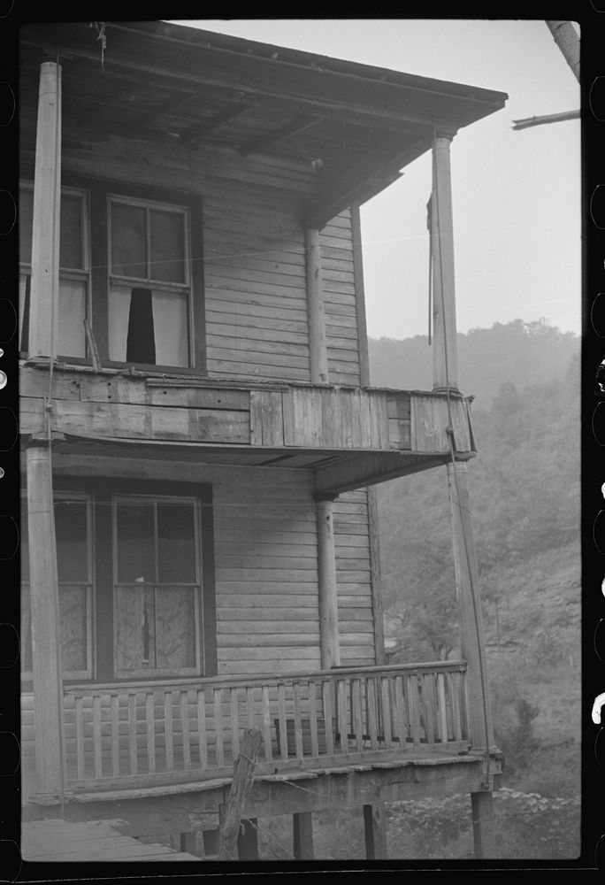 [Untitled photo, possibly related to: Former miners' boardinghouse now inhabited by seven families, almost all on relief in…