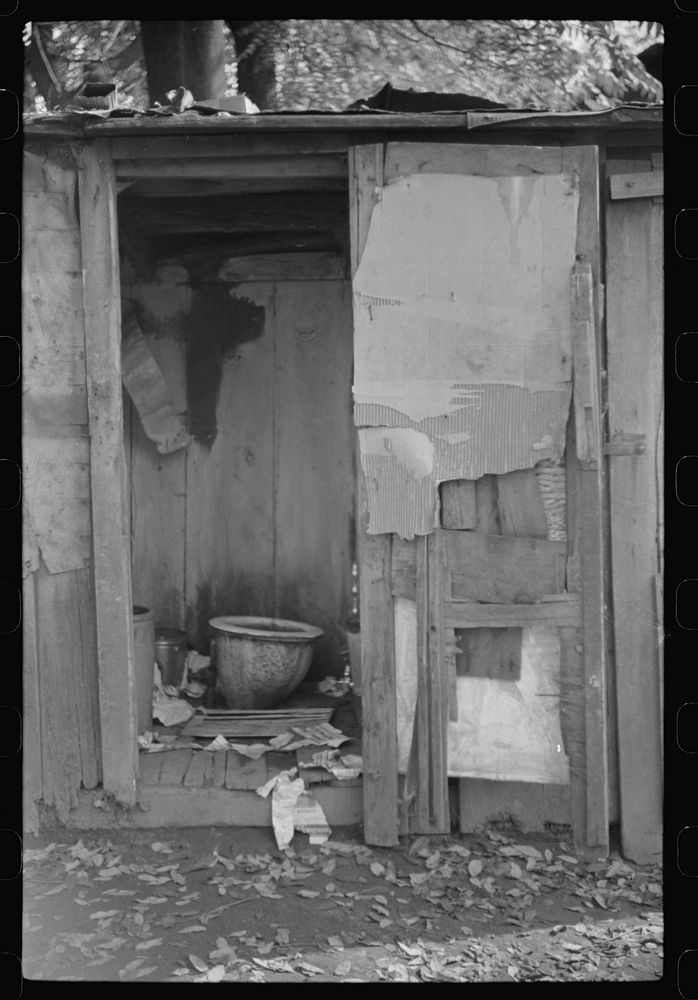 Privy in African American section "Paradise Alley." Only one for sixty people. Charleston, West Virginia by Marion Post…