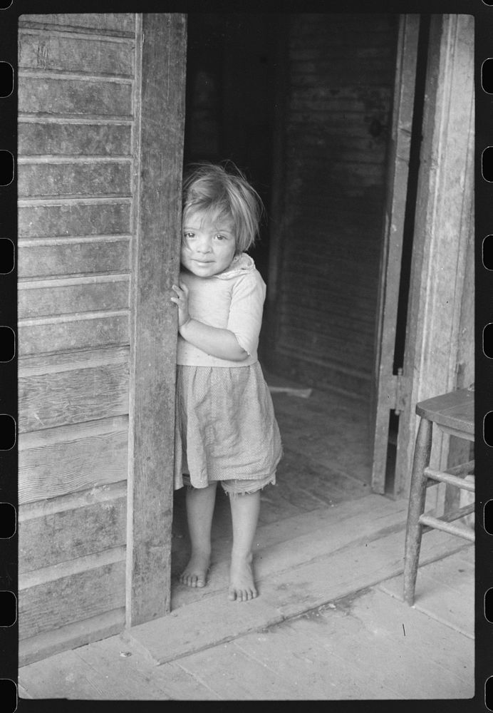 [Untitled photo, possibly related to: Mexican miner's child in doorway of home, Bertha Hill, West Virginia] by Marion Post…