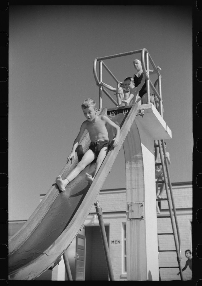 Sliding into the pool at Greenbelt, Maryland. Sourced from the Library of Congress.