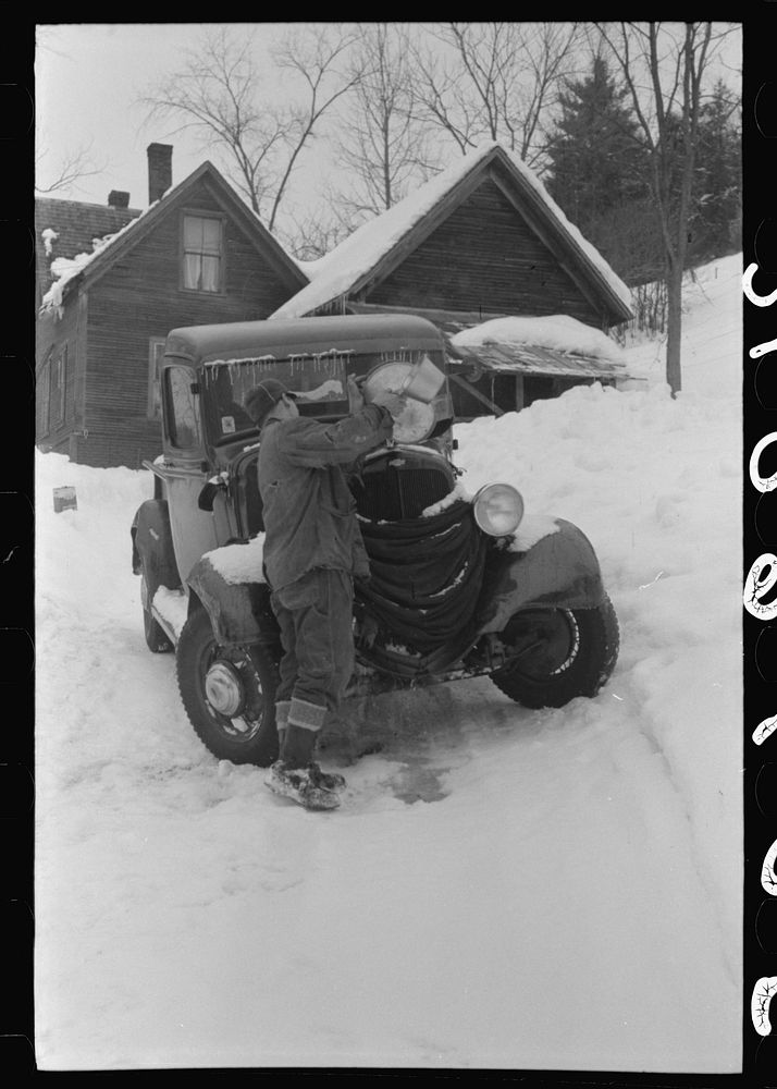 [Untitled photo, possibly related to: Hired man on farm near Woodstock, Vermont, usually empties the radiator in his car…