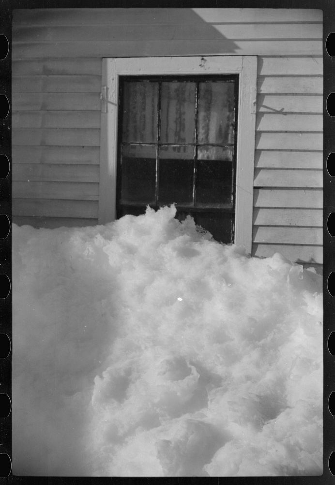 Exceptionally deep snow and sliding snow from roof almost covered the windows of many farmhouses. Woodstock, Vermont.…