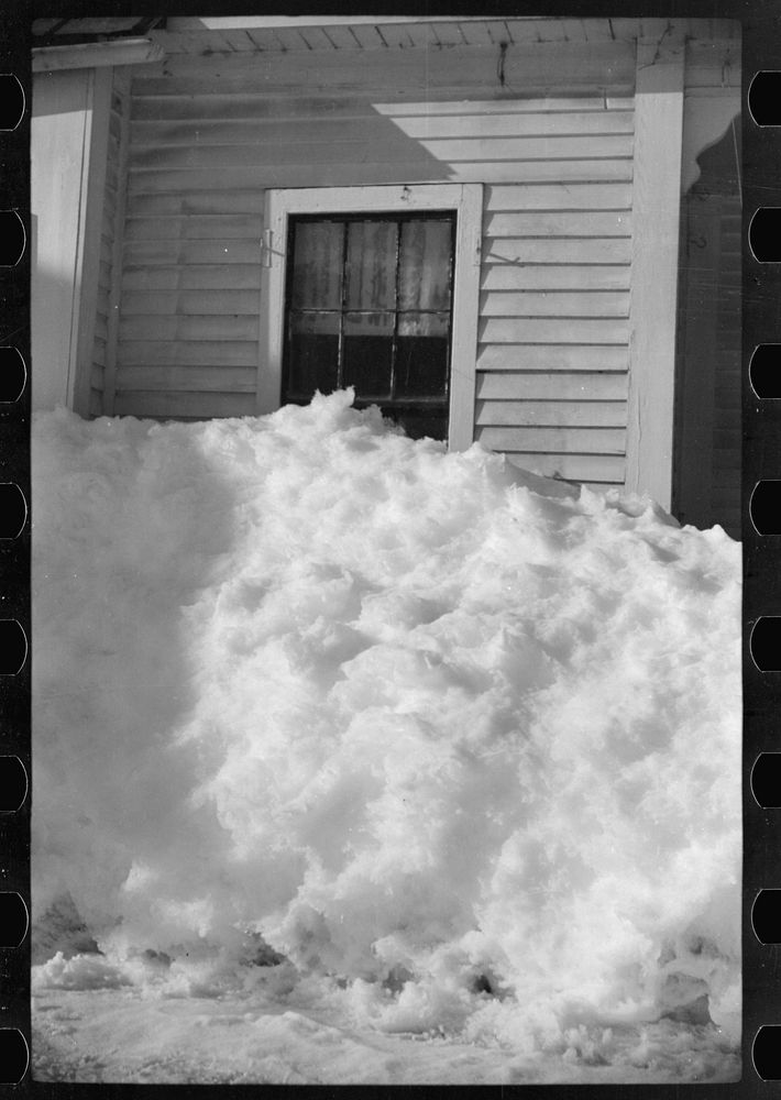 [Untitled photo, possibly related to: Exceptionally deep snow and sliding snow from roof almost covered the windows of many…