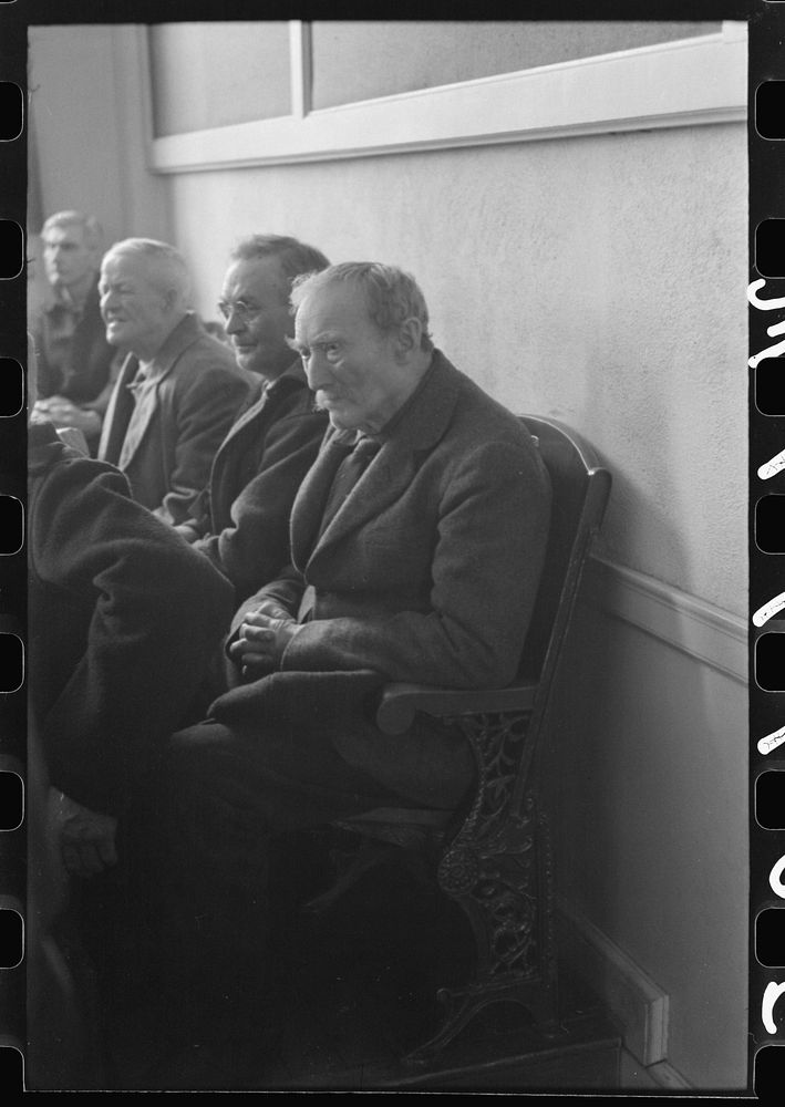 Townspeople listening to discussion during town meeting, Woodstock, Vermont. Sourced from the Library of Congress.