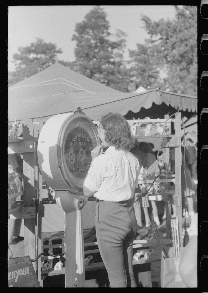 Midway and carnival at Shelby County Fair and Horse Show Shelbyville, Kentucky. Sourced from the Library of Congress.