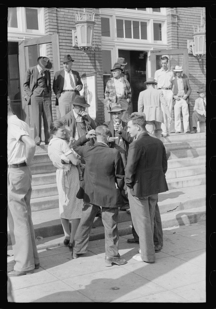 Mountain people exchanging greetings and news on court day in front of the federal building, Jackson, Breathitt County…