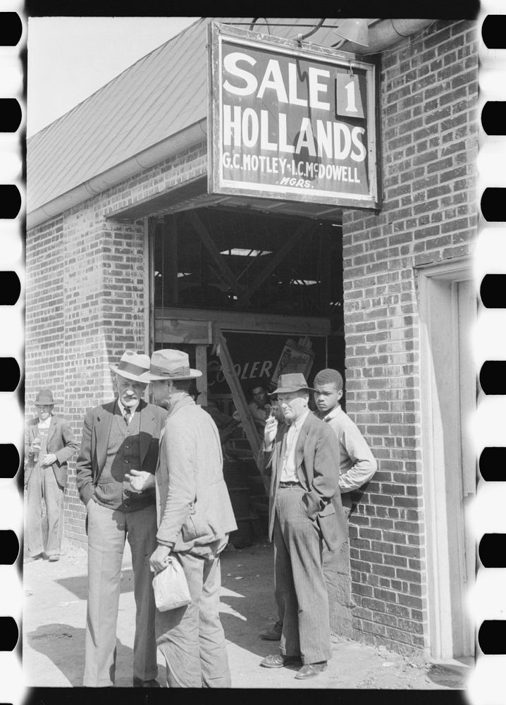 Farmers waiting outside of warehouse during tobacco auction sale. Danville, Virginia. Sourced from the Library of Congress.
