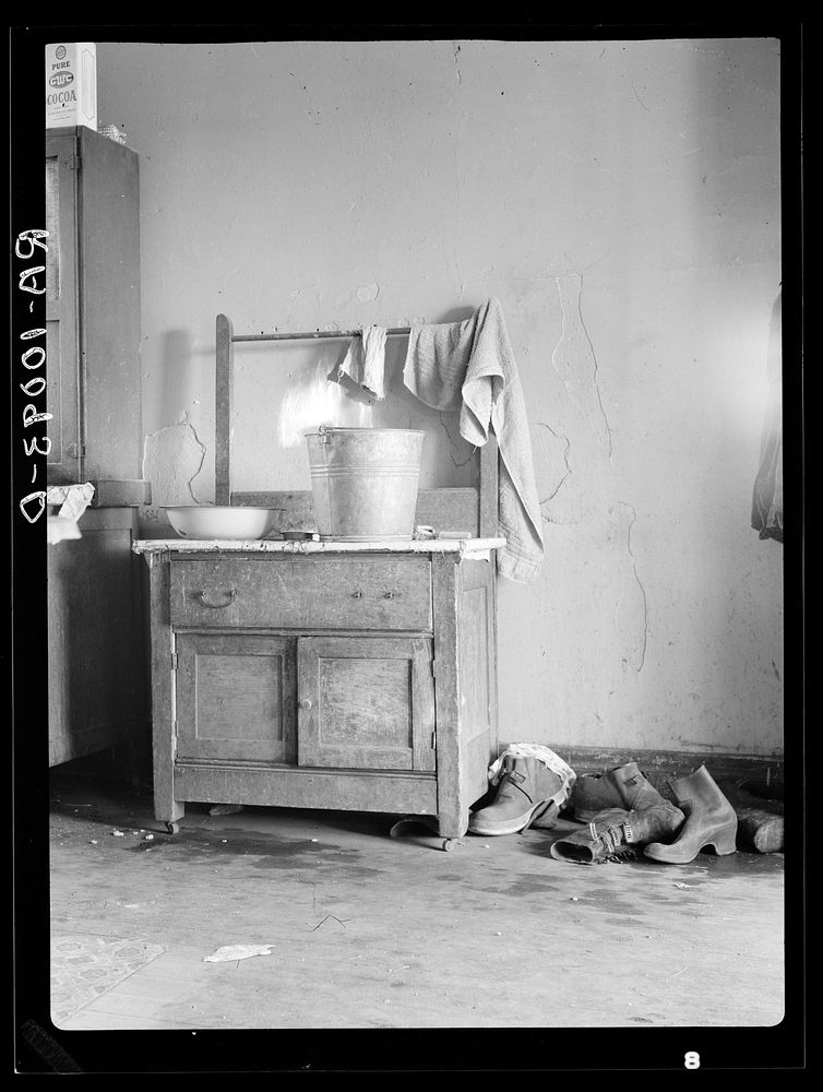Washstand in corner of kitchen of Edgar Allen's home on farm near Milford, Iowa. Contrast this with washstand picture of…