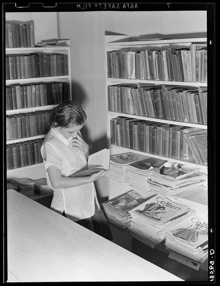 Arvin camp for migrant workers (Farm Security Administration-FSA) California. A small library in camp with Works Progress…