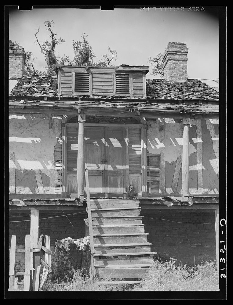 Entrance to old Trepagnier plantation house near Norco, Louisiana. This house is now occupied by es by Russell Lee