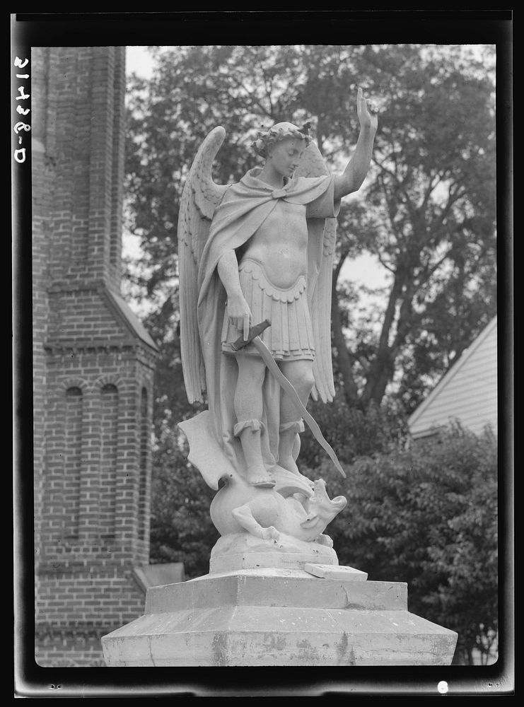 Statue in front of Saint John's Church. Convent, Louisiana by Russell Lee