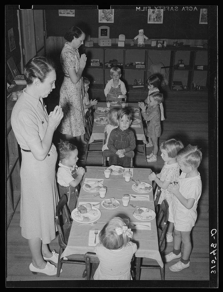 Schoolchildren giving thanks before lunch. Lake Dick Project, Arkansas by Russell Lee