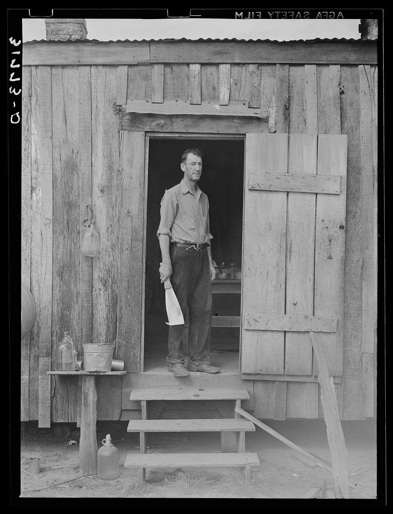 M. LaBlanc standing in doorway of present farm home. Morganza, Louisiana by Russell Lee
